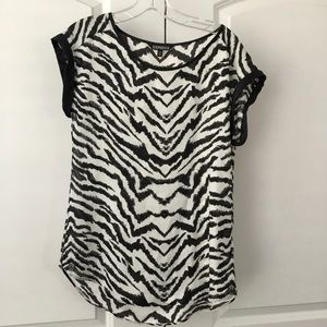 Women’s black and white blouse.